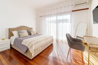 a bedroom with a bed and a desk and a chair at 85mq of Vintage Luxury-Near Vatican City WIFI AC in Rome