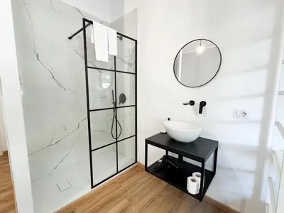 a bathroom with a sink and a mirror at Riboty Boutique Rooms in Rome