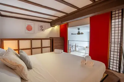 a bedroom with a bed with two towels on it at Pgrhome Campitelli in Rome