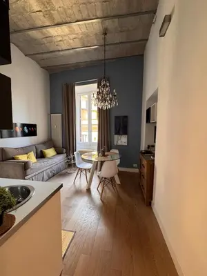 a living room with a couch and a table at Residenza Labicana few steps from Colosseum in Rome