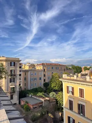 a view of a city with buildings and a blue sky at Residenza Labicana few steps from Colosseum in Rome