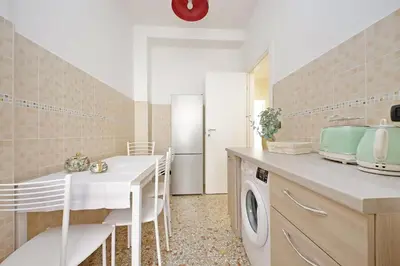 a living room with a couch and a television at Domus 68 - Apartment with terrace in Rome