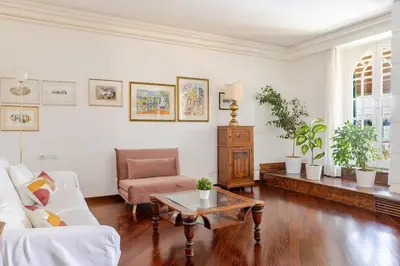 a living room with a couch and a table at Urbanflat Colosseum in Rome
