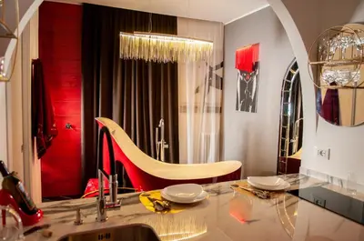 a dining room with a table and a mirror at Suite Tacco 12 in Rome