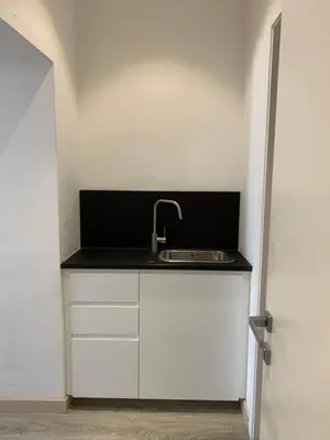 a kitchen with a sink next to a door at Centro Roma Giallo - LOCAPPART in Rome
