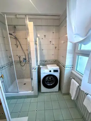a washing machine in a bathroom with a shower at Civico3 in Città Piazza del Popolo in Rome