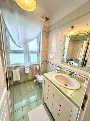 a bathroom with a sink and a toilet and a mirror at Civico3 in Città Piazza del Popolo in Rome