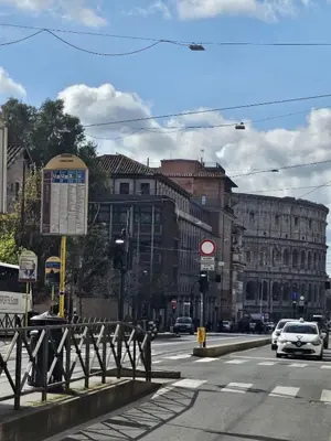 a busy city street with cars on the road at Colosseum Luxury suite 26 in Rome