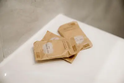two bags of food sitting on a white table at Michelangelo Luxury Rooms - Colosseo - WiFi in Rome