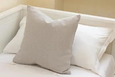 a pillow sitting on top of a bed at Nel Cuore di Testaccio by Rental in Rome in Rome