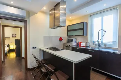 a kitchen with a sink and a counter top at Nel Cuore di Testaccio by Rental in Rome in Rome