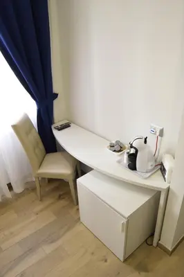 a room with a white table and a chair at Vatican Giulia in Rome