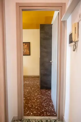 a door leading into a hallway with a room at Yellow Pop Apartment - Design e Colore a Roma in Rome