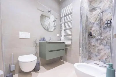 a bathroom with a toilet and a sink and a shower at Casa Gemma Rome in Rome