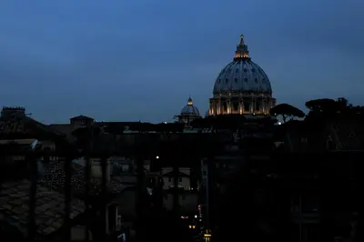 a view of a dome of a building at night at St Peter Vatican wonderfull view apartment in Rome