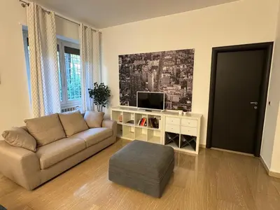 a living room with a couch and a tv at Appia 101 Guest House in Rome