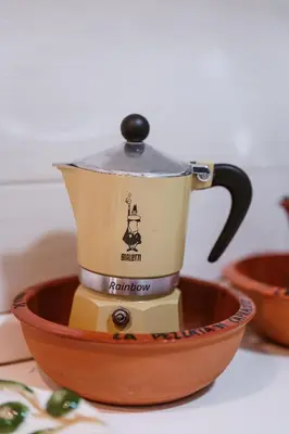 a coffee maker in a bowl on a table at Vacanze Romane - Metro Teano & Wi-Fi in Rome