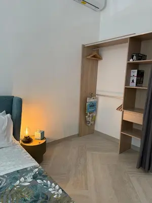 a bedroom with a bed and a room with a closet at Domus Battistini in Rome