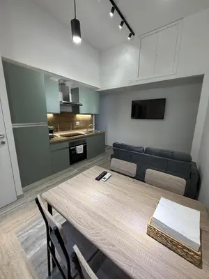 a living room with a table and a couch at Domus Battistini in Rome