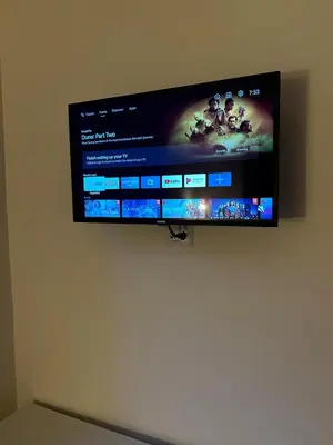 a flat screen tv hanging on a wall at Dante Art Home in Rome