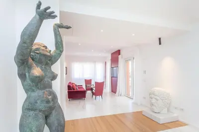 a statue of a woman in a living room at Arte della Medaglia Gallery House in Rome