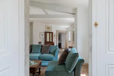 a living room with blue couches and a table at iFlat Historic Charm & Comfort by Piazza Navona in Rome
