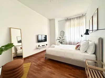 a bathroom with a white sink and a mirror at Casa Mazz San Giovanni in Rome