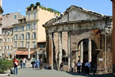 a group of people standing around an old building at Loft Navona in Rome