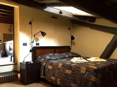 a bedroom with a bed with two towels on it at Loft Navona in Rome