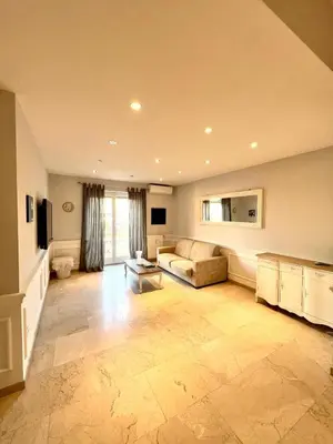 a large living room with a couch and a television at San Pietro APT near Vatican city Roma in Rome