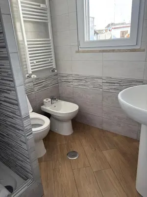 a bathroom with a toilet and a sink at San Peter-Vatican Way in Rome