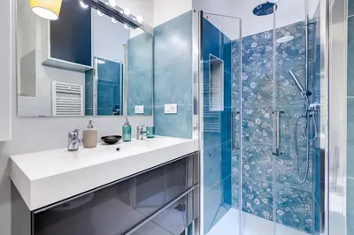 a bathroom with a sink and a shower at LuxurySistersHouse 2 min Colosseum in Rome