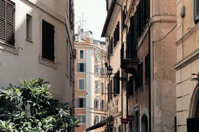 a narrow street with buildings in a city at Casa Mia Navona in Rome