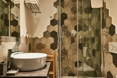 a bathroom with a tub and a glass shower at Ale & Niki's Home in Rome