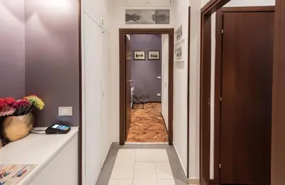 a hallway with a door leading into a room at Vite Suites Guest House in Rome