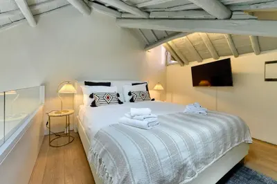 a bedroom with a bed with towels on it at Skylife Monti's Wonders - Colosseum Gem in Rome