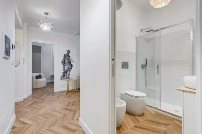 a bathroom with a shower and a toilet and a sink at Vatican Design Apartment - NEW! in Rome