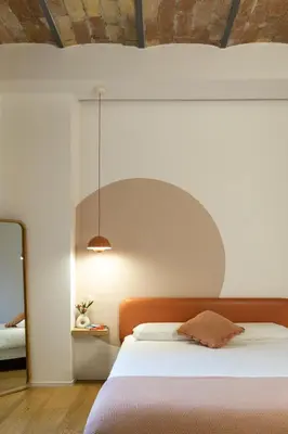 a bedroom with a white bed and a mirror at Colosseum - Diana's Design Apartment in Rome