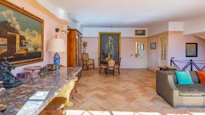 a living room with a couch and a table at EasyTopStay - Charme and View in the Heart of Rome in Rome