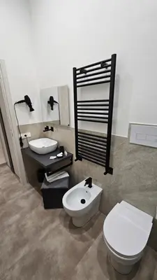 a bathroom with a toilet and a sink at Casa Camillo in Rome