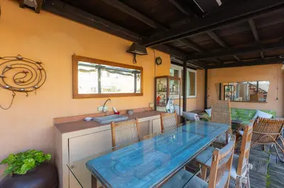 a kitchen with a glass table in a room at Borgo Vittorio Terrace by Rental in Rome in Rome