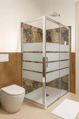 a bathroom with a toilet and a glass cabinet at 4 Seasons Roma Trastevere in Rome