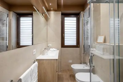 a bathroom with a sink and a toilet and a shower at ROMAN DREAM lll in Rome