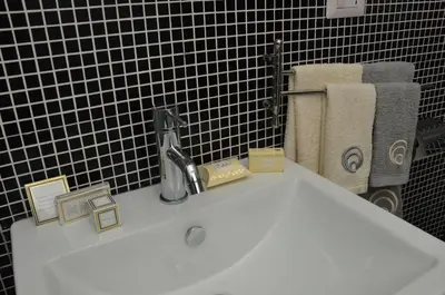 a bathroom sink with a faucet on top of it at Rhome Lungotevere River in Rome