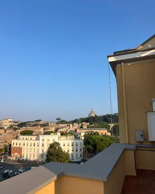 a view of a city from the roof of a building at F R Vatican view apartment in Rome