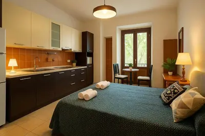 a kitchen with a large bed in a room at RELAX Palace in Rome