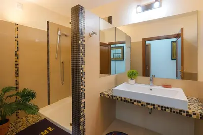 a bathroom with a sink and a shower and a mirror at RELAX Palace in Rome