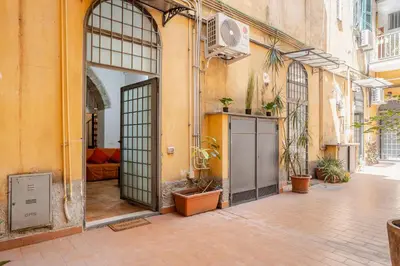 an entrance to a building with an open door at La Casetta Aureliana in the center of the capital in Rome