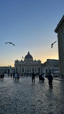 a group of people walking in front of a building at Le Case di Emma in Rome