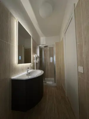 a bathroom with a sink and a mirror at Suite 41 in Rome